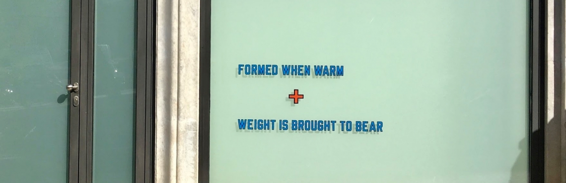 Lawrence Weiner, FORMED WHEN WARM + WEIGHT IS BROUGHT TO BEAR , 1983.  Col. Maria e Armando Cabral